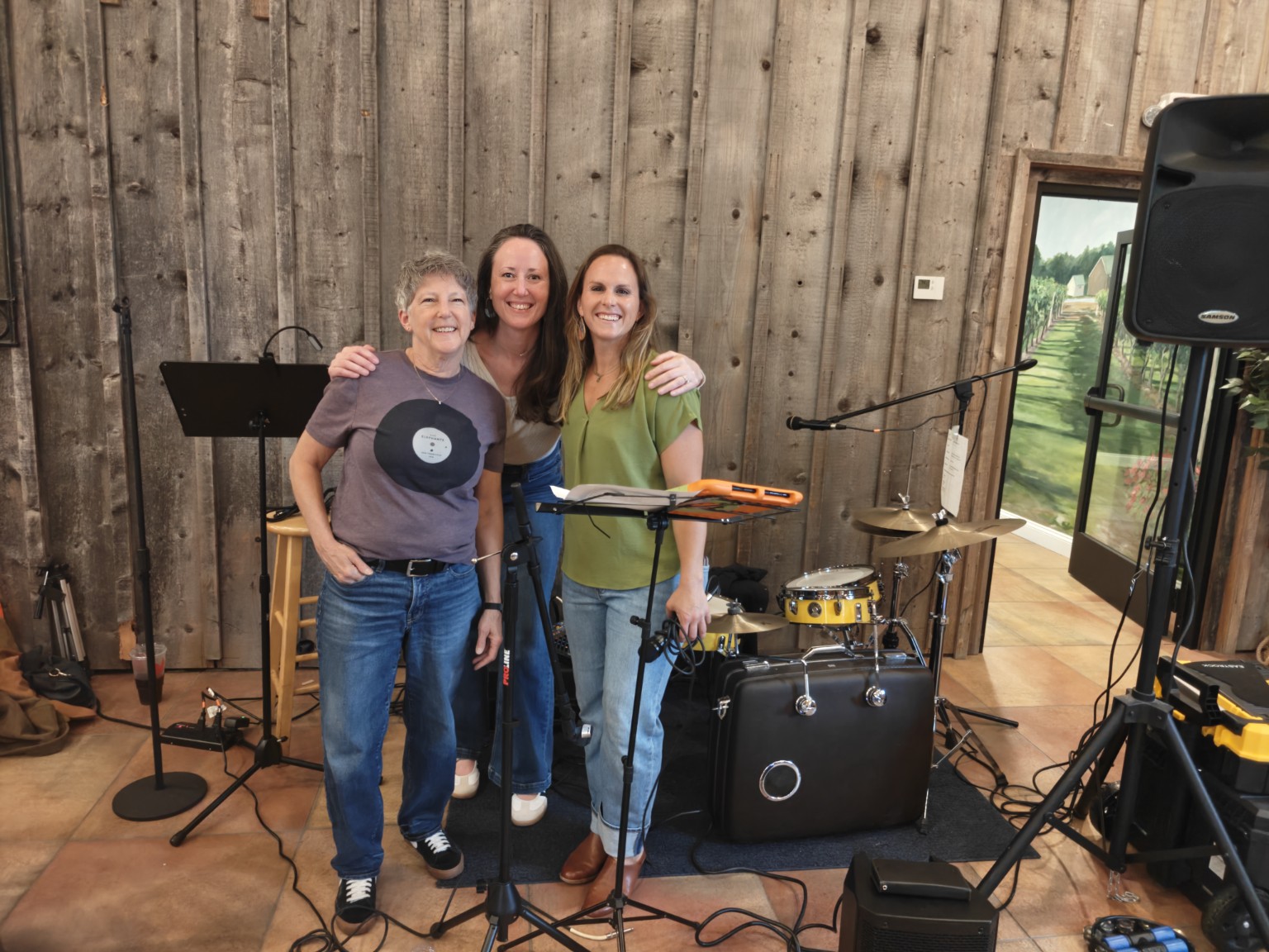 Katie with fellow musicians beside their instruments after a performance